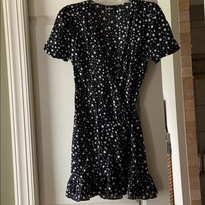 Wrap dress with ruffle side and hem